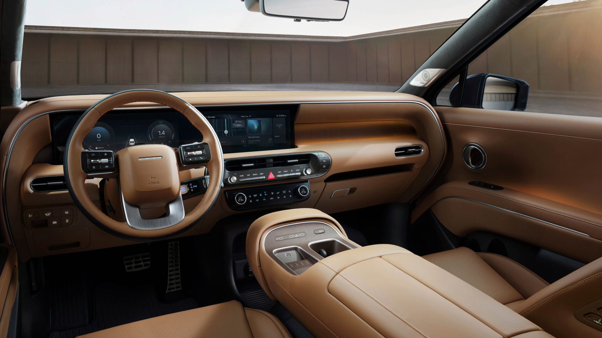 Side-front view of orange Grandi10 with lakeside view at night